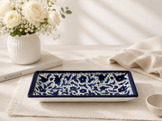 Premium glazed ceramic serving tray with an elegant blue floral design.