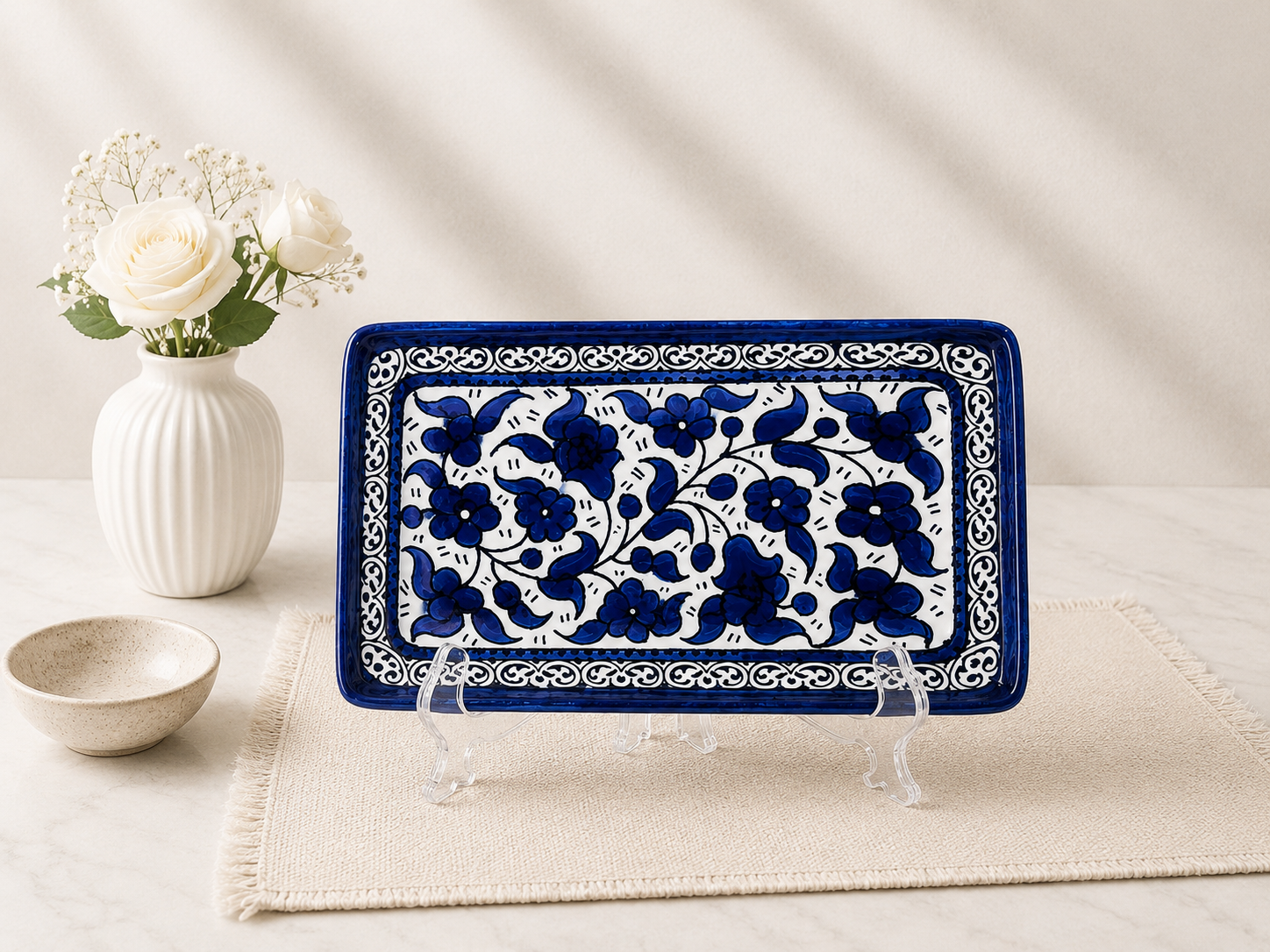 handcrafted rectangular plate features an elegant cobalt blue floral pattern