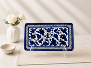 handcrafted rectangular plate features an elegant cobalt blue floral pattern