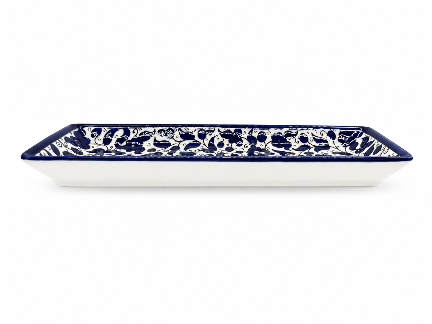 handcrafted rectangular serving platter showcases an elegant deep cobalt blue floral pattern.