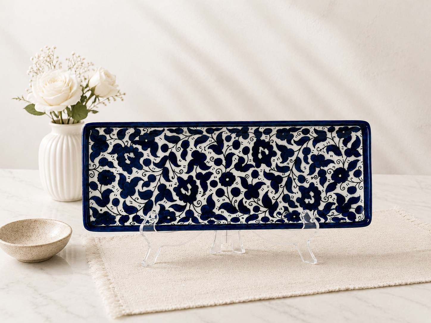 handcrafted rectangular serving platter showcases an elegant deep cobalt blue floral pattern.