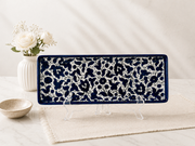 handcrafted rectangular serving platter showcases an elegant deep cobalt blue floral pattern.