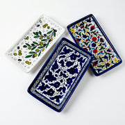 Hand-painted ceramic shown in three patterns