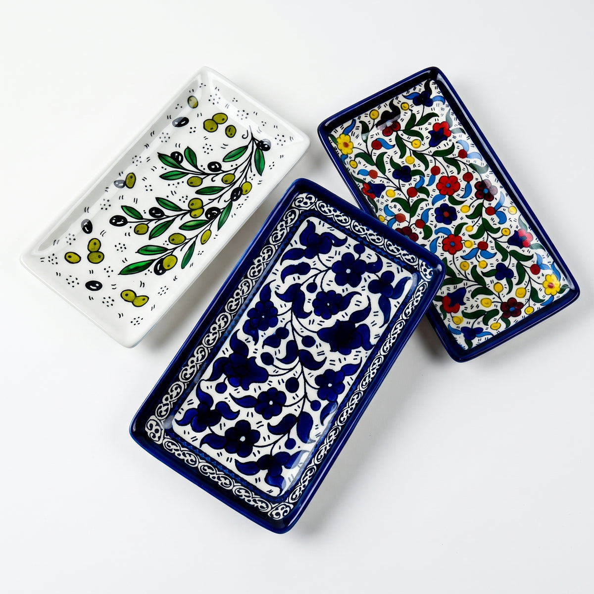 Hand-painted ceramic shown in three patterns
