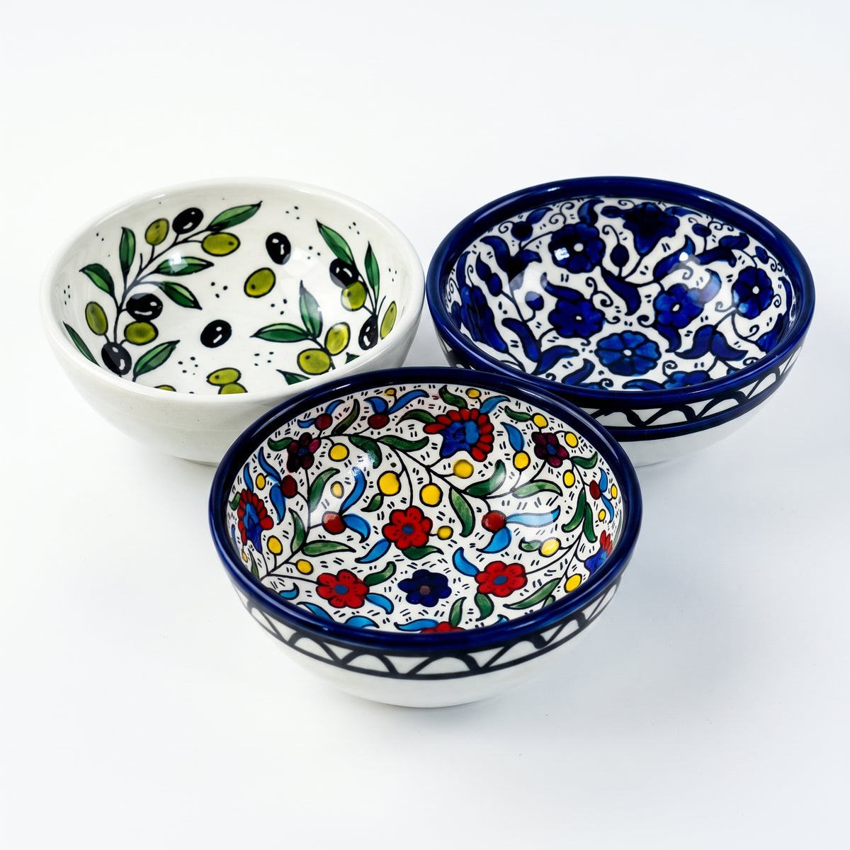 Hand-painted ceramic shown in three patterns
