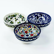 Hand-painted ceramic shown in three patterns
