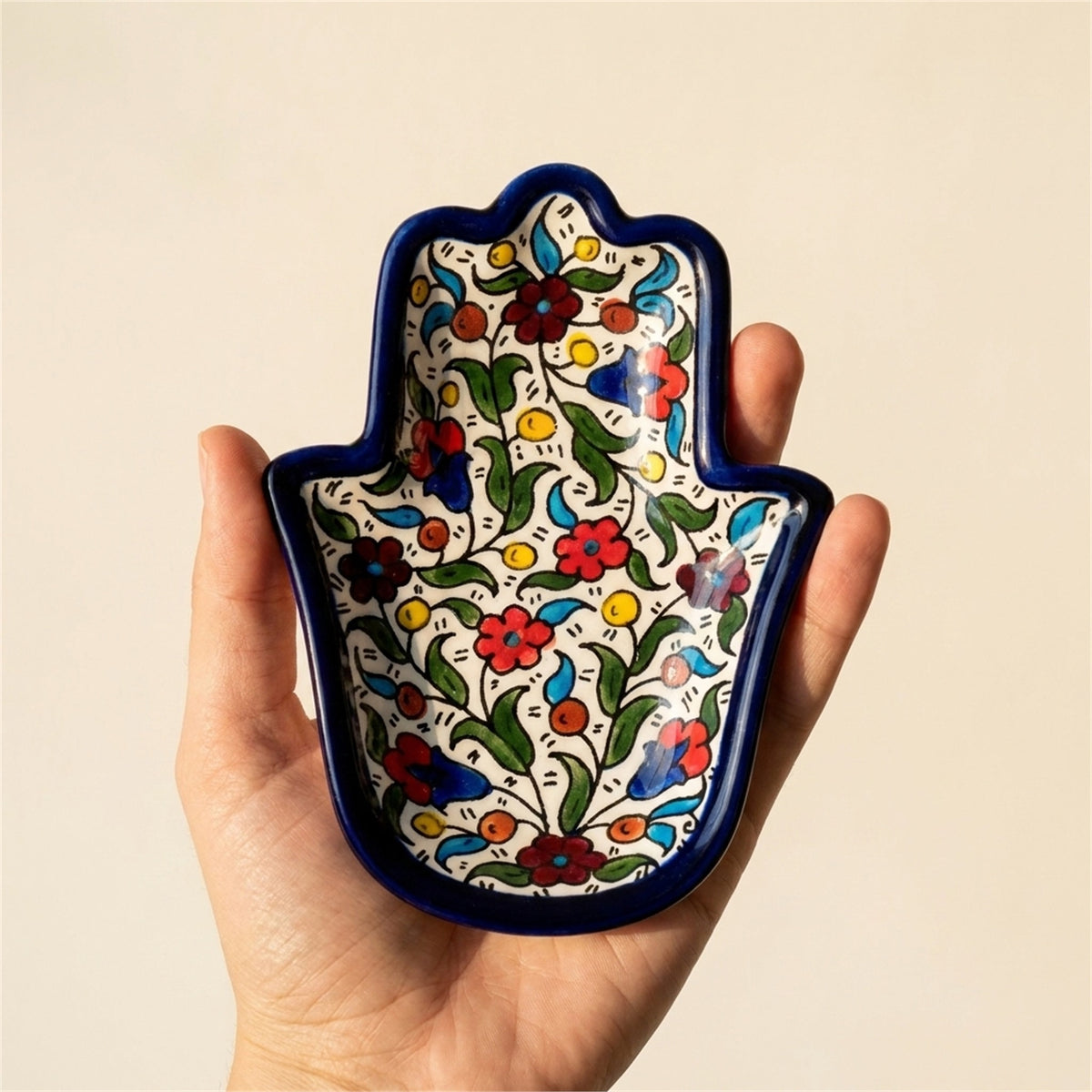 Ceramic Hamsa Dish 7.09 Inch in Floral, held in hands to show scale