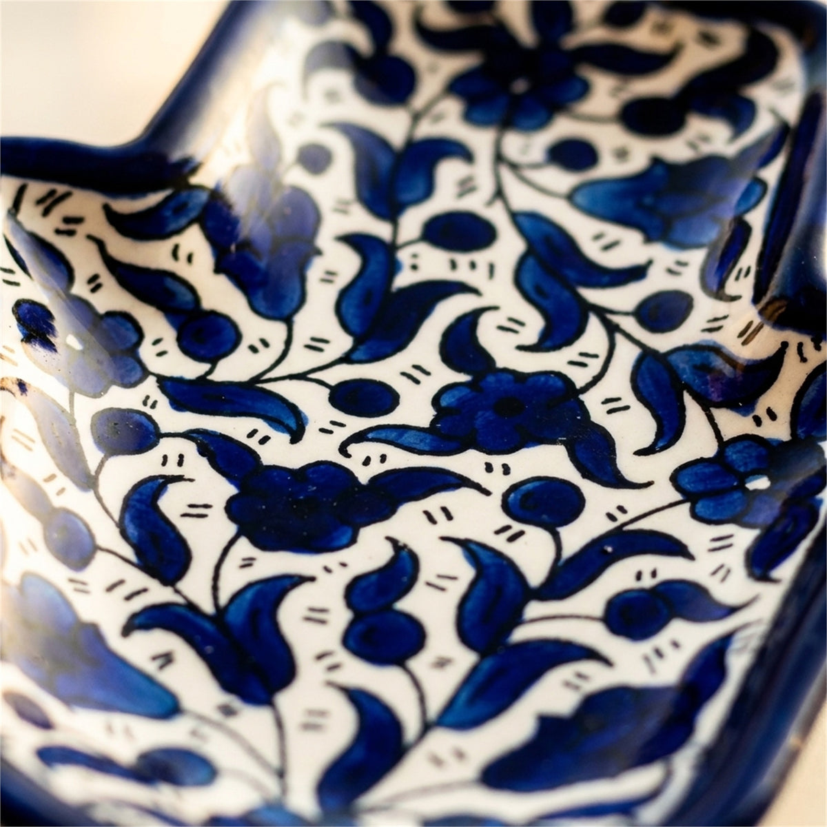 Ceramic Hamsa Dish 7.09 Inch in Indigo, close-up of the hand-painted detail