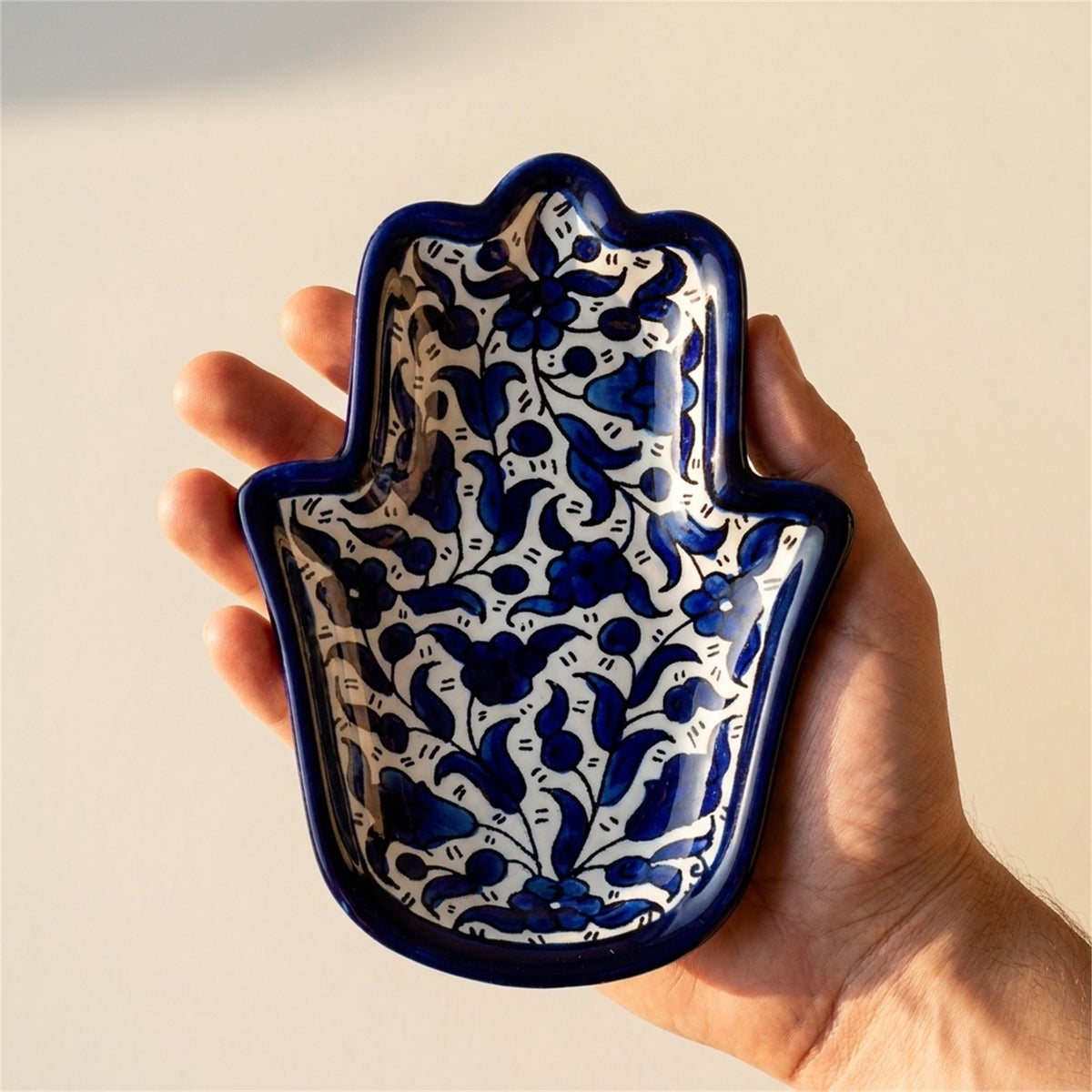 Ceramic Hamsa Dish 7.09 Inch in Indigo, held in hands to show scale