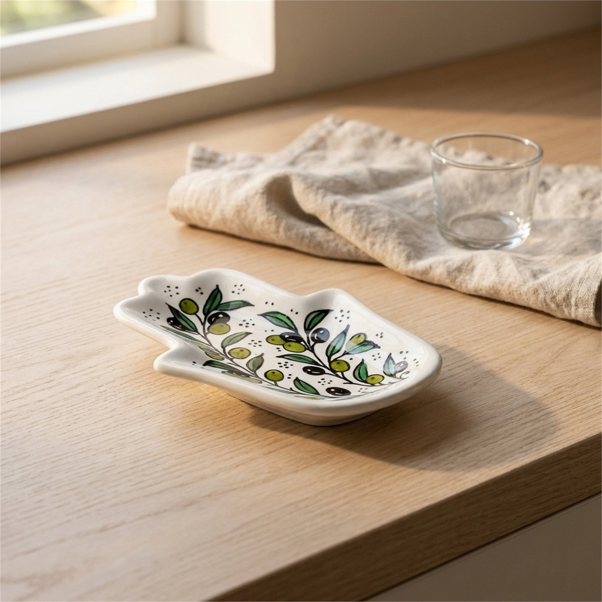 Ceramic Hamsa Dish 7.09 Inch in Olive Green, styled on a set table