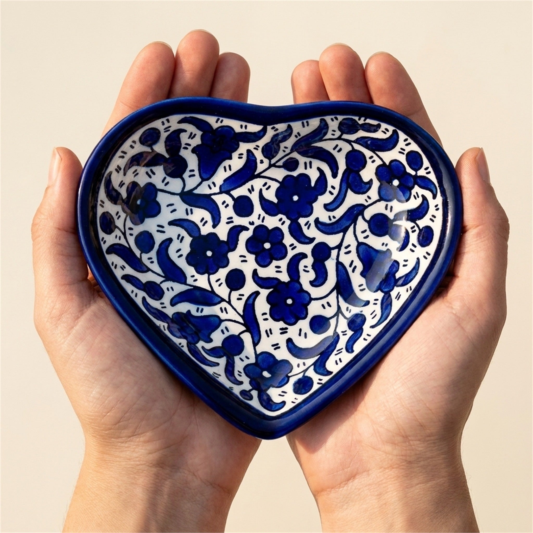 Ceramic Heart Dish 5.51 Inch in Indigo, held in hands to show scale