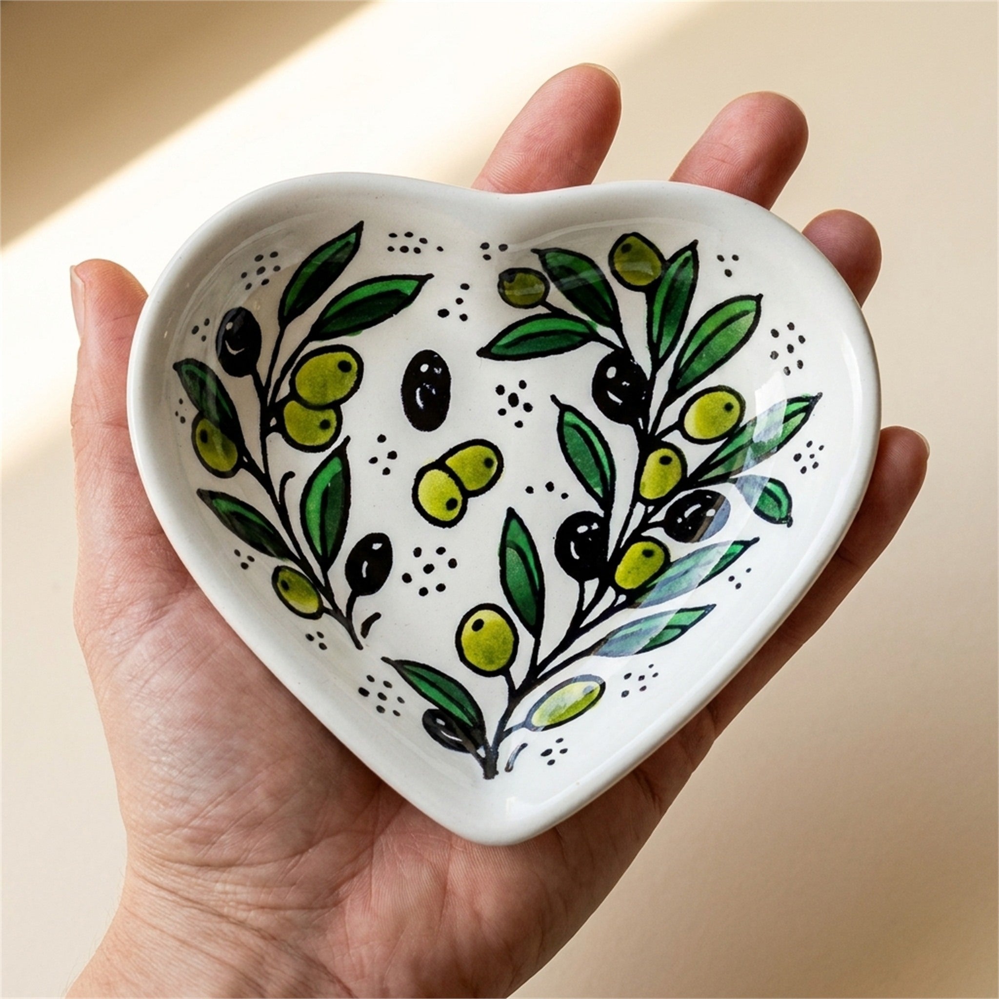 Ceramic Heart Dish 5.51 Inch in Olive Green, held in hands to show scale
