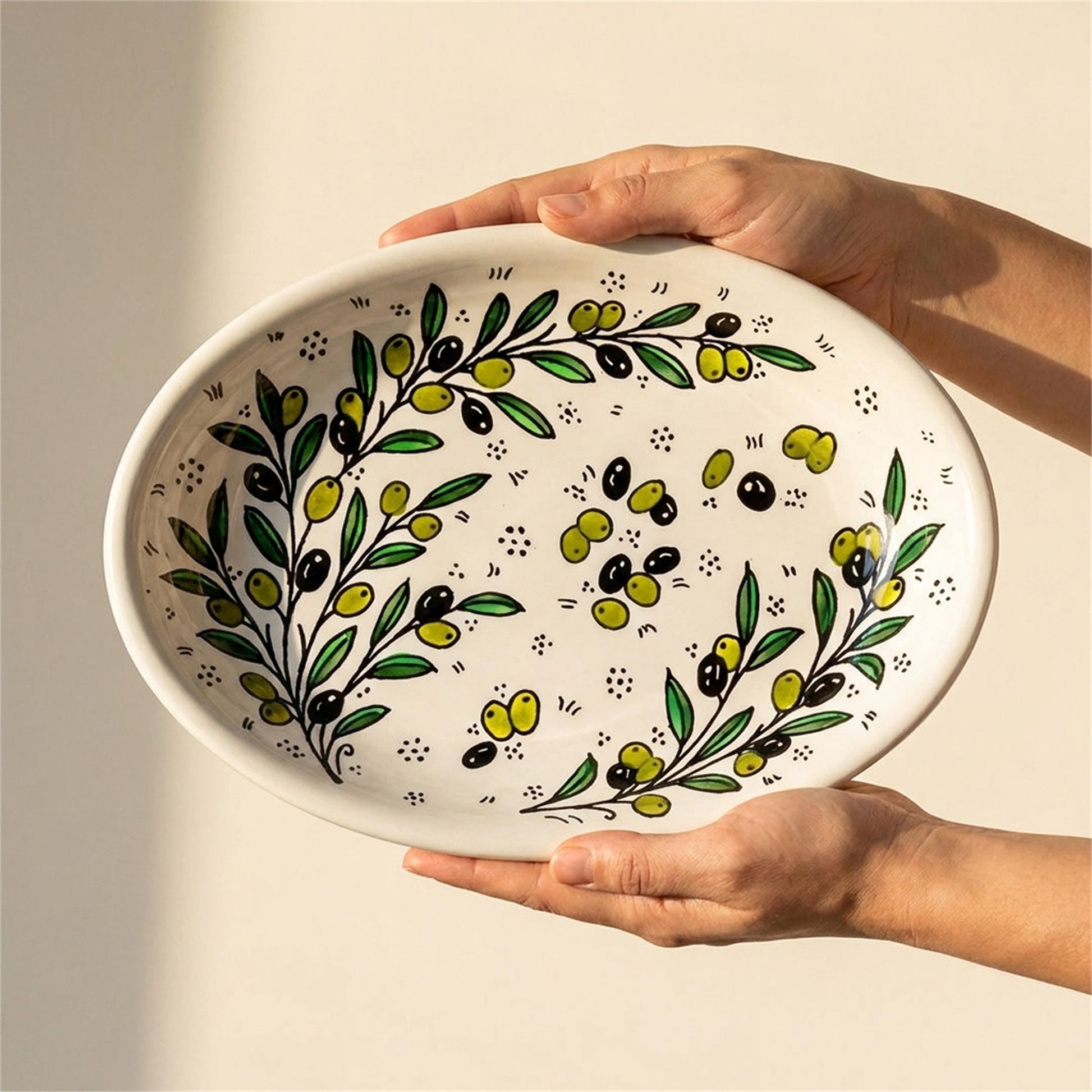 Ceramic Oval Serving Dish 11.81 Inch in Olive Green, held in hands to show scale