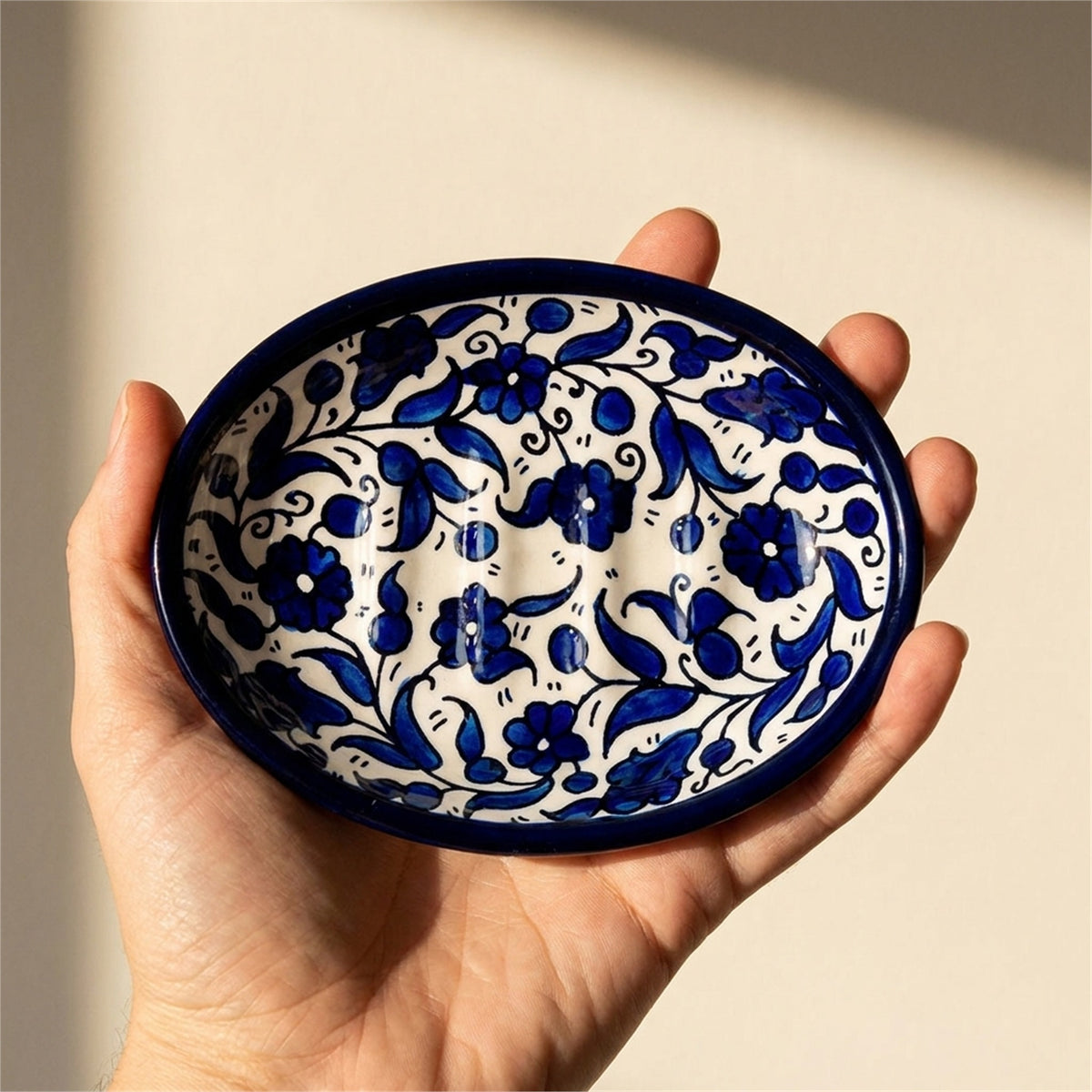 Ceramic Oval Serving Dish 5.51 Inch in Indigo, held in hands to show scale