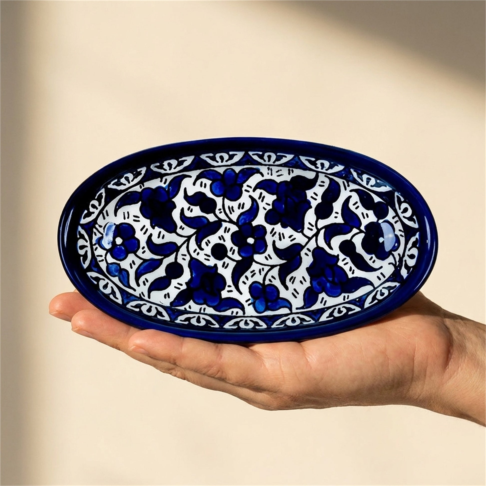 Ceramic Oval Serving Dish 6.7 Inch in Indigo, held in hands to show scale