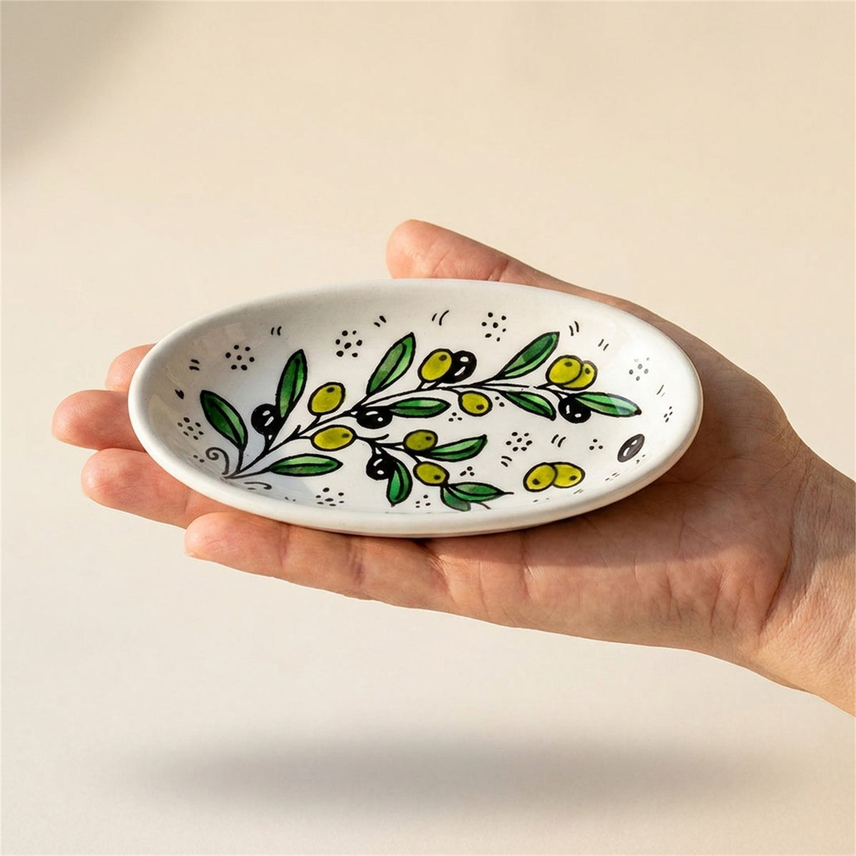 Ceramic Oval Serving Dish 6.7 Inch in Olive Green, held in hands to show scale