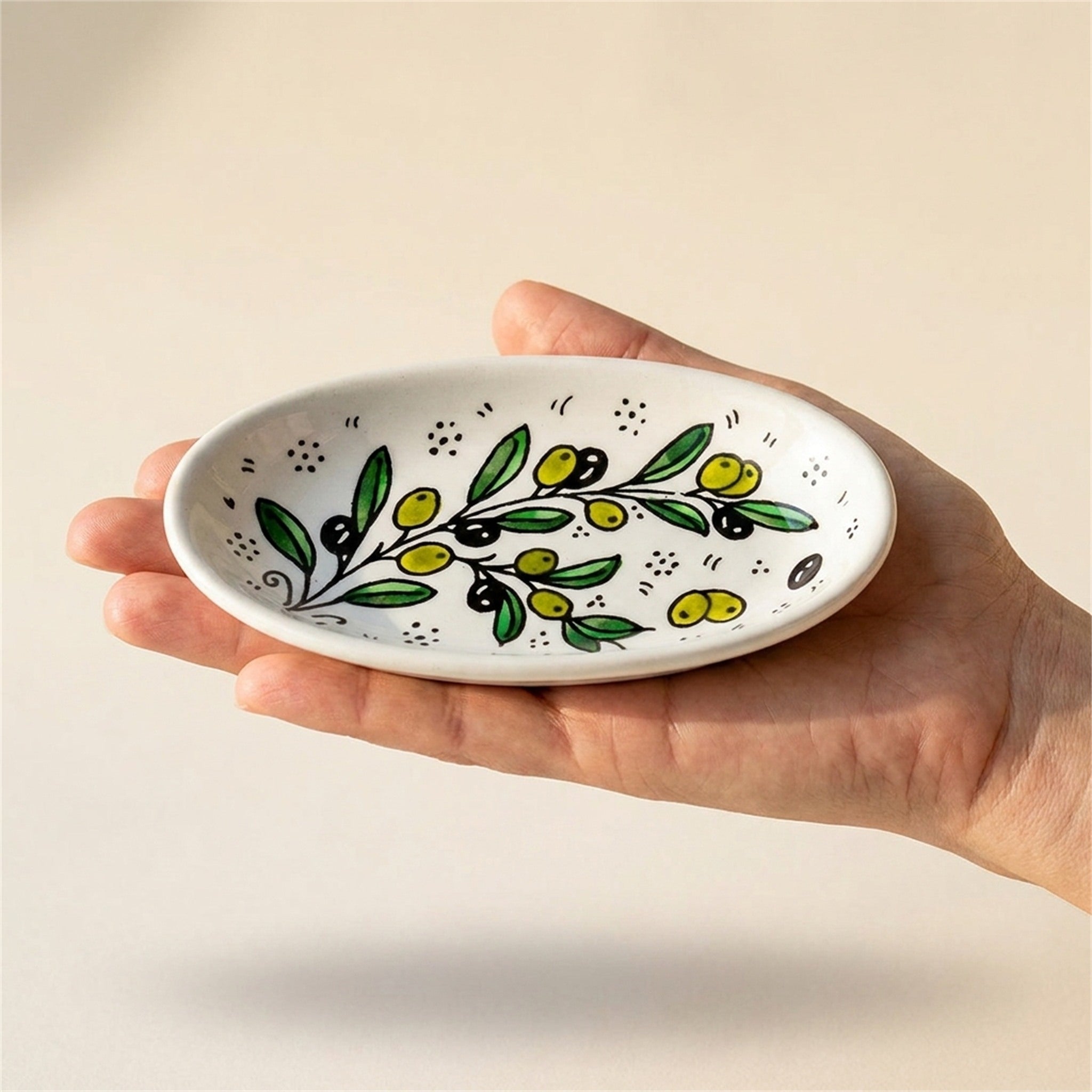 Ceramic Oval Serving Dish 6.7 Inch in Olive Green, held in hands to show scale