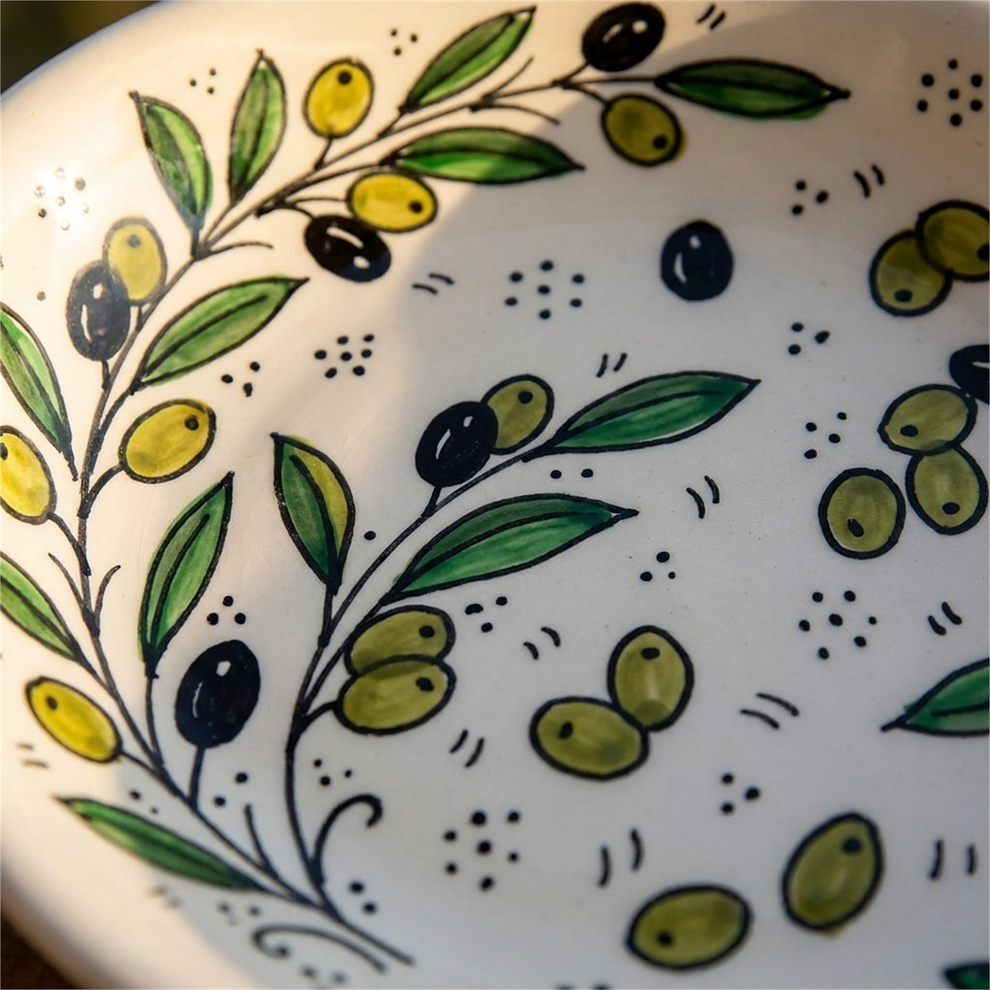 Ceramic Oval Serving Dish 9.06 Inch in Olive Green, close-up of the hand-painted detail