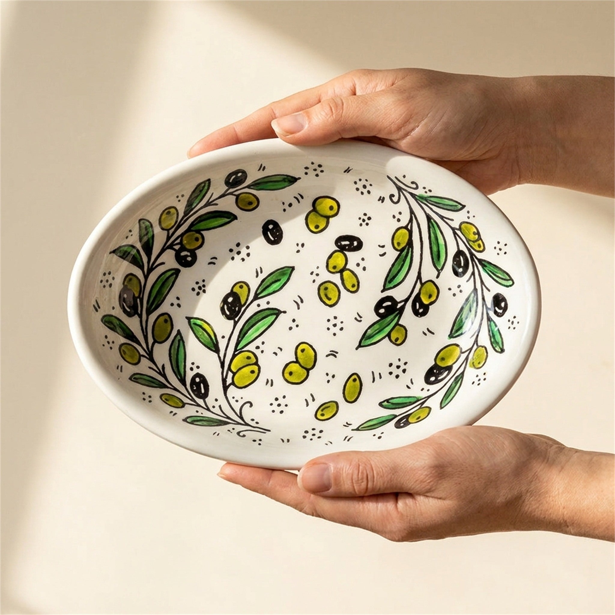 Ceramic Oval Serving Dish 9.06 Inch in Olive Green, held in hands to show scale