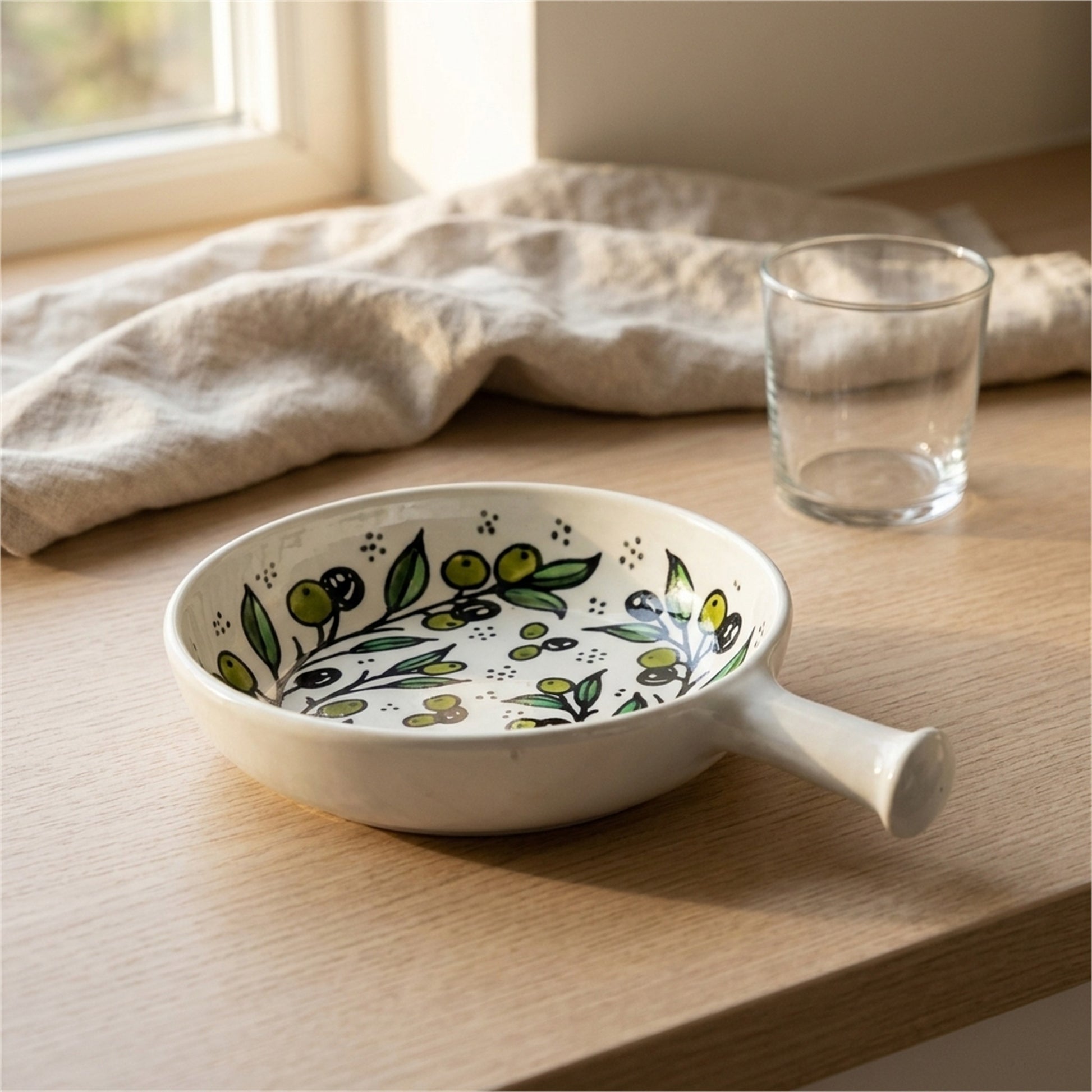 Ceramic Single Handle Bowl 6.3 Inch in Olive Green, styled on a set table