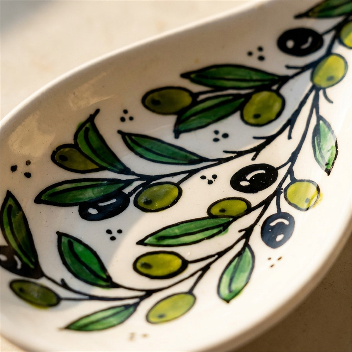 Ceramic Spoon Rest 9.84 Inch in Olive Green, close-up of the hand-painted detail