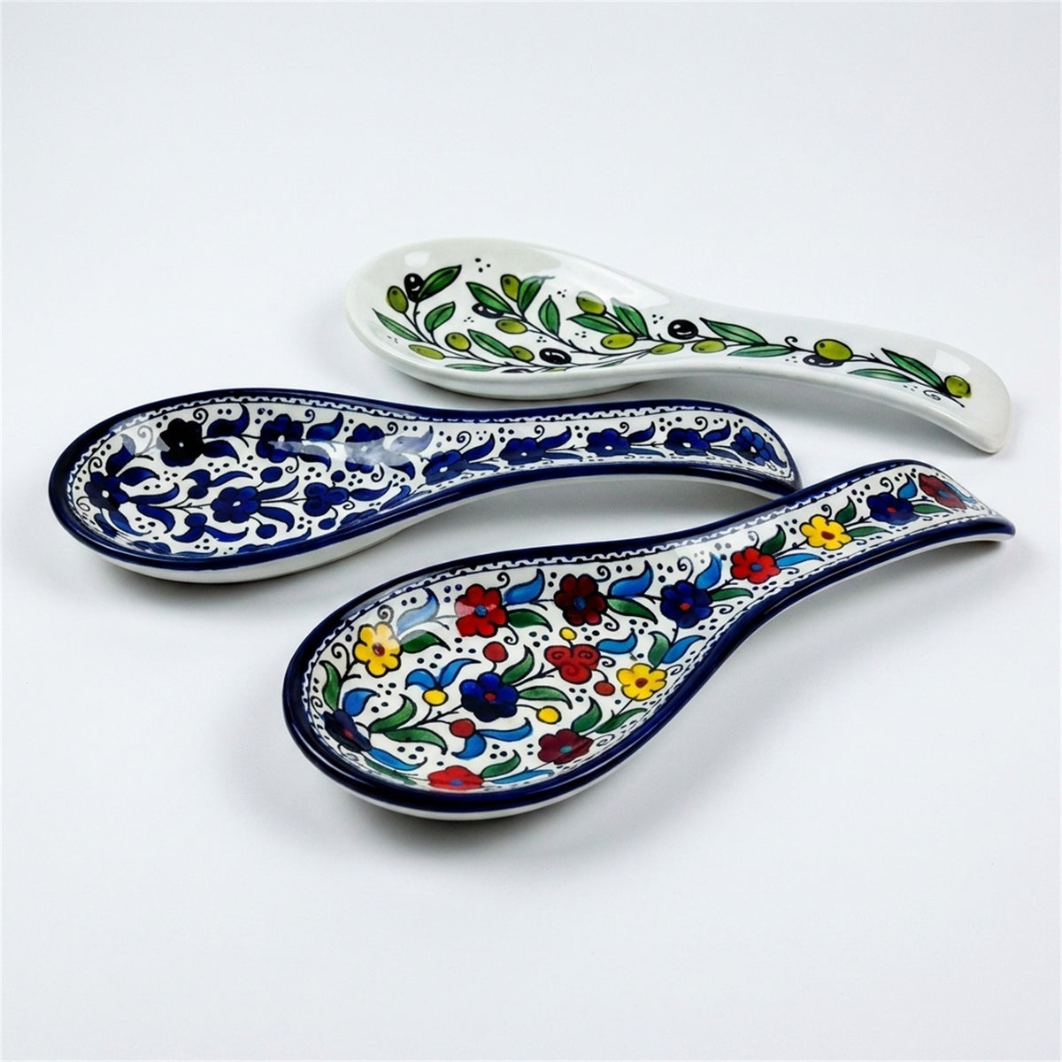 Ceramic Spoon Rest 9.84 Inch shown in all three hand-painted patterns