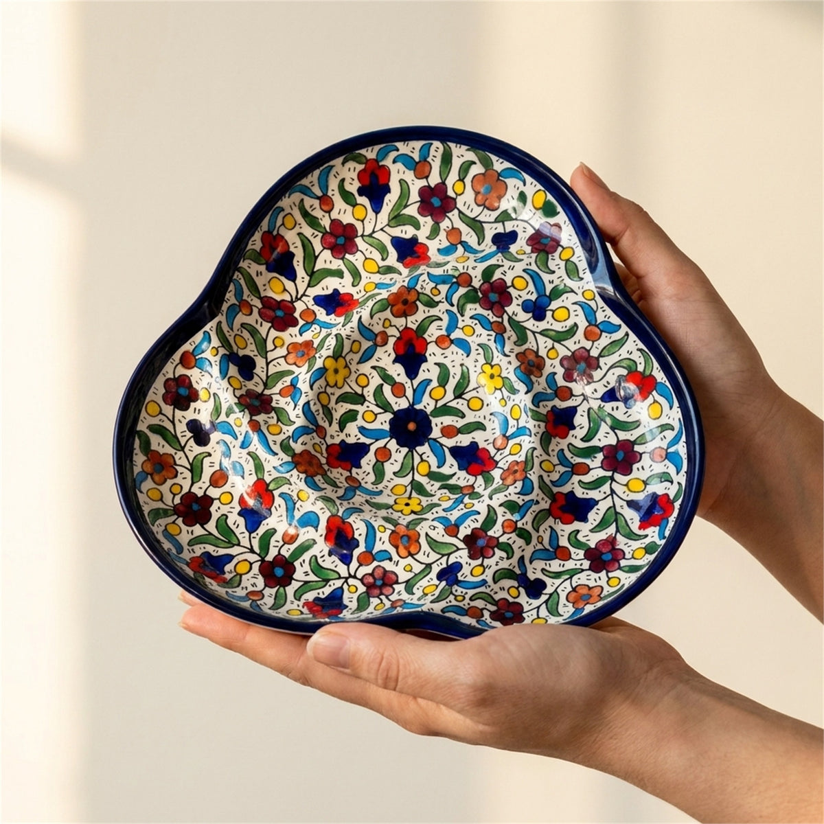 Ceramic Trefoil Dish 9.84 Inch in Floral, held in hands to show scale