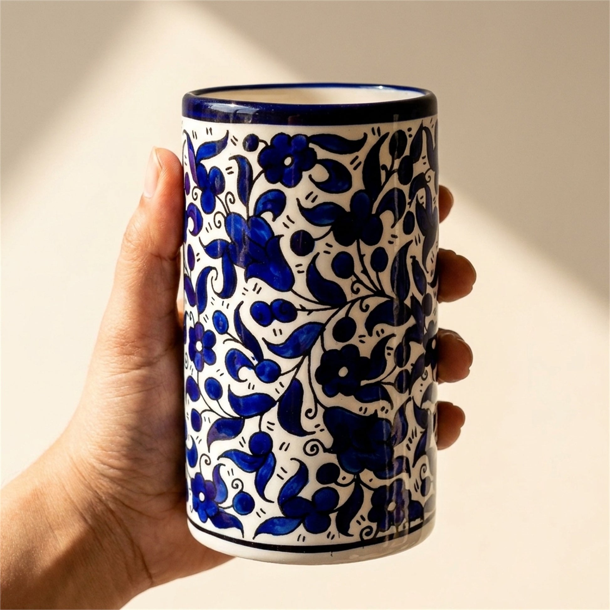 Ceramic Utensil Holder 3.94 Inch in Indigo, held in hands to show scale