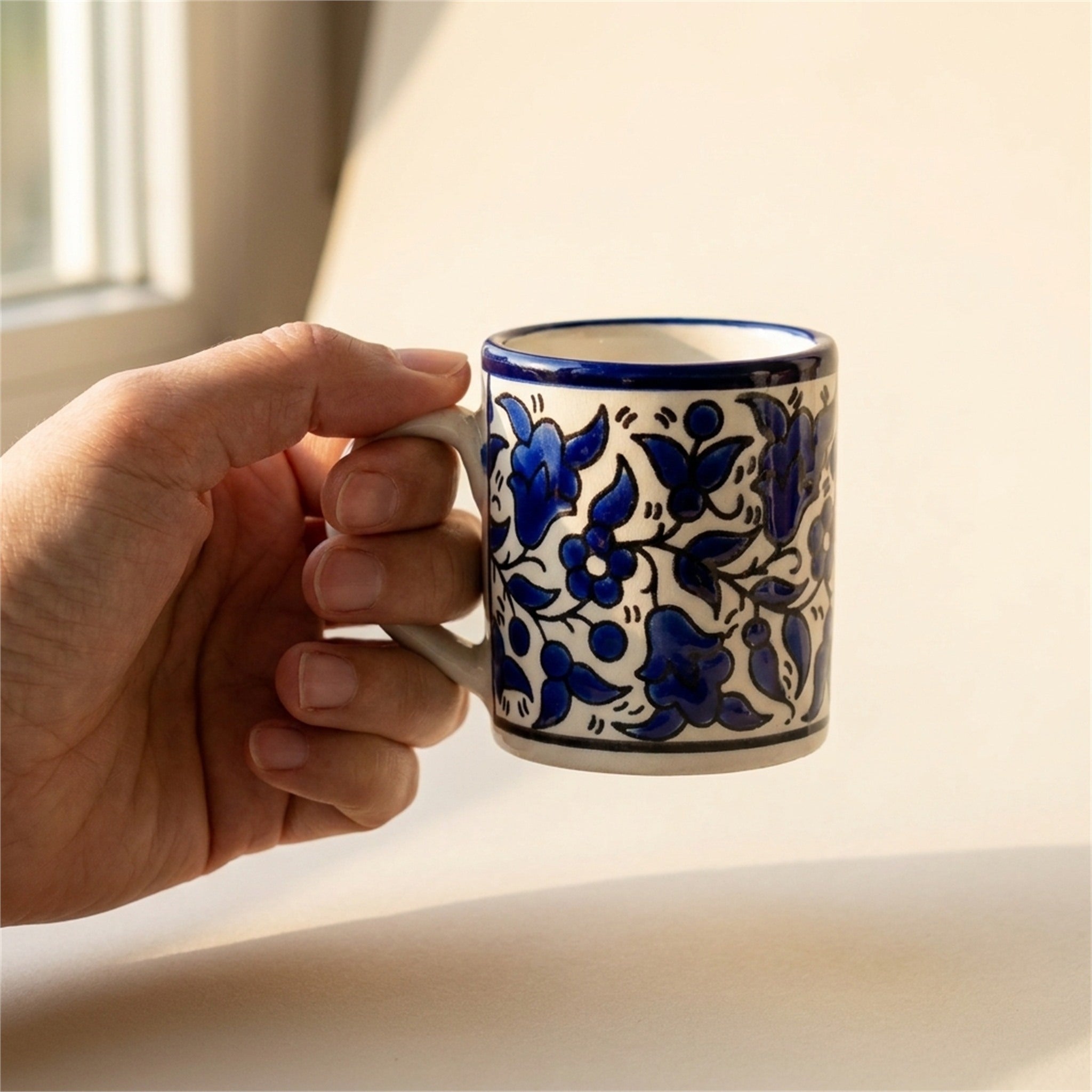 Floral Heritage Mug 2.36 Inch in Indigo, held in hands to show scale