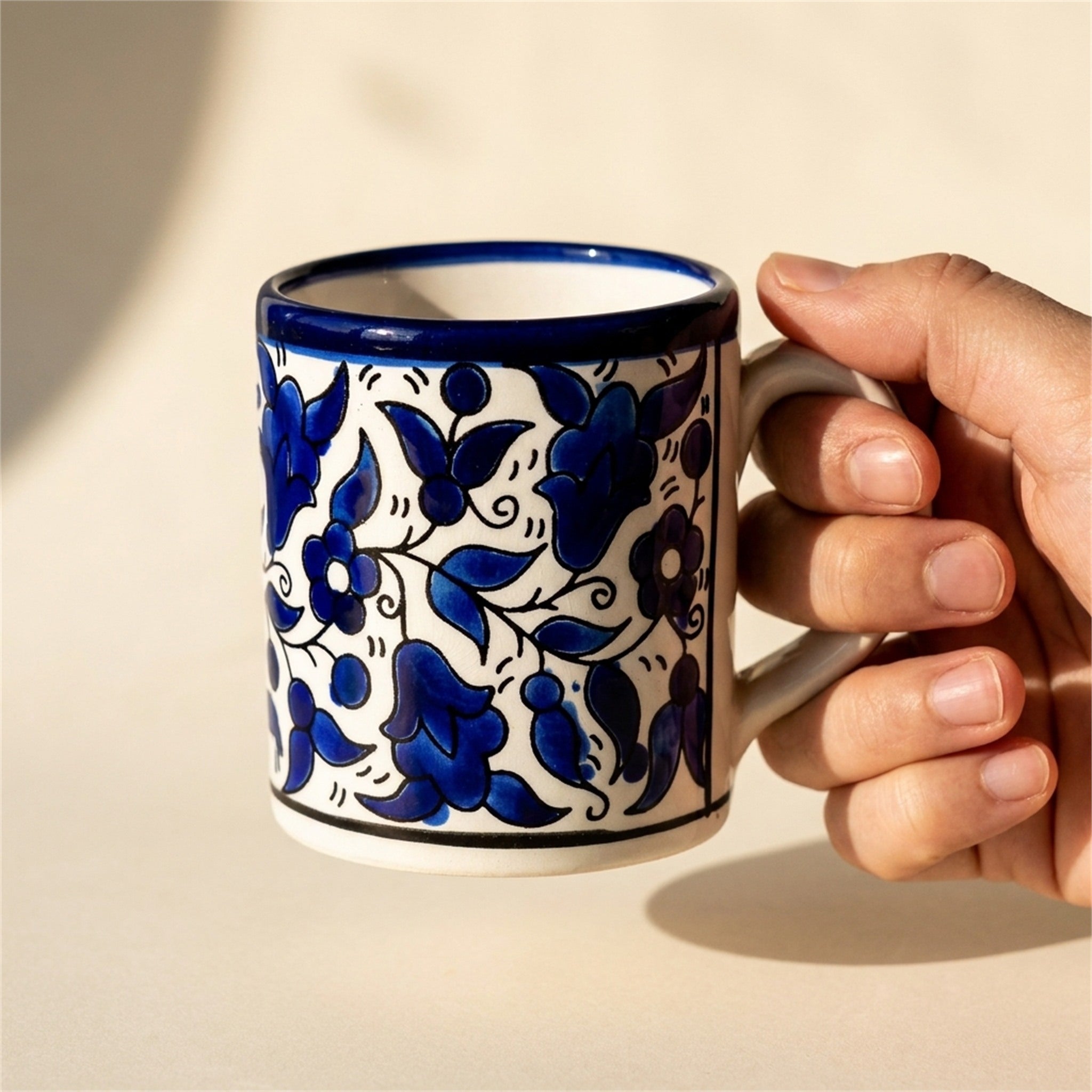 Floral Heritage Mug 2.76 Inch in Indigo, held in hands to show scale