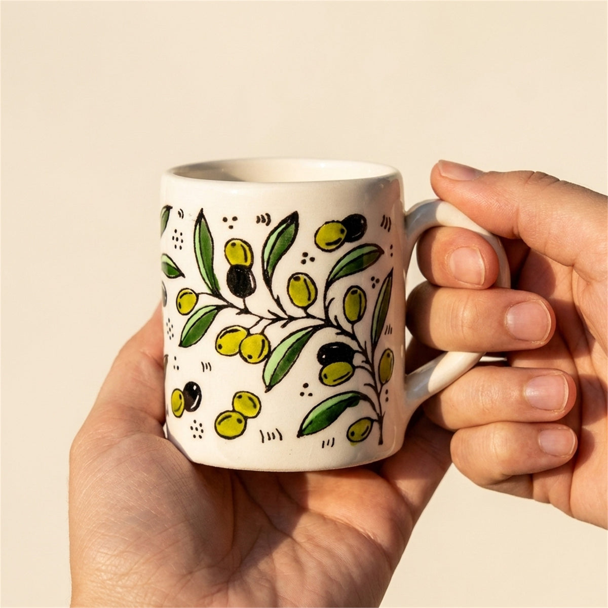 Floral Heritage Mug 2.76 Inch in Olive Green, held in hands to show scale