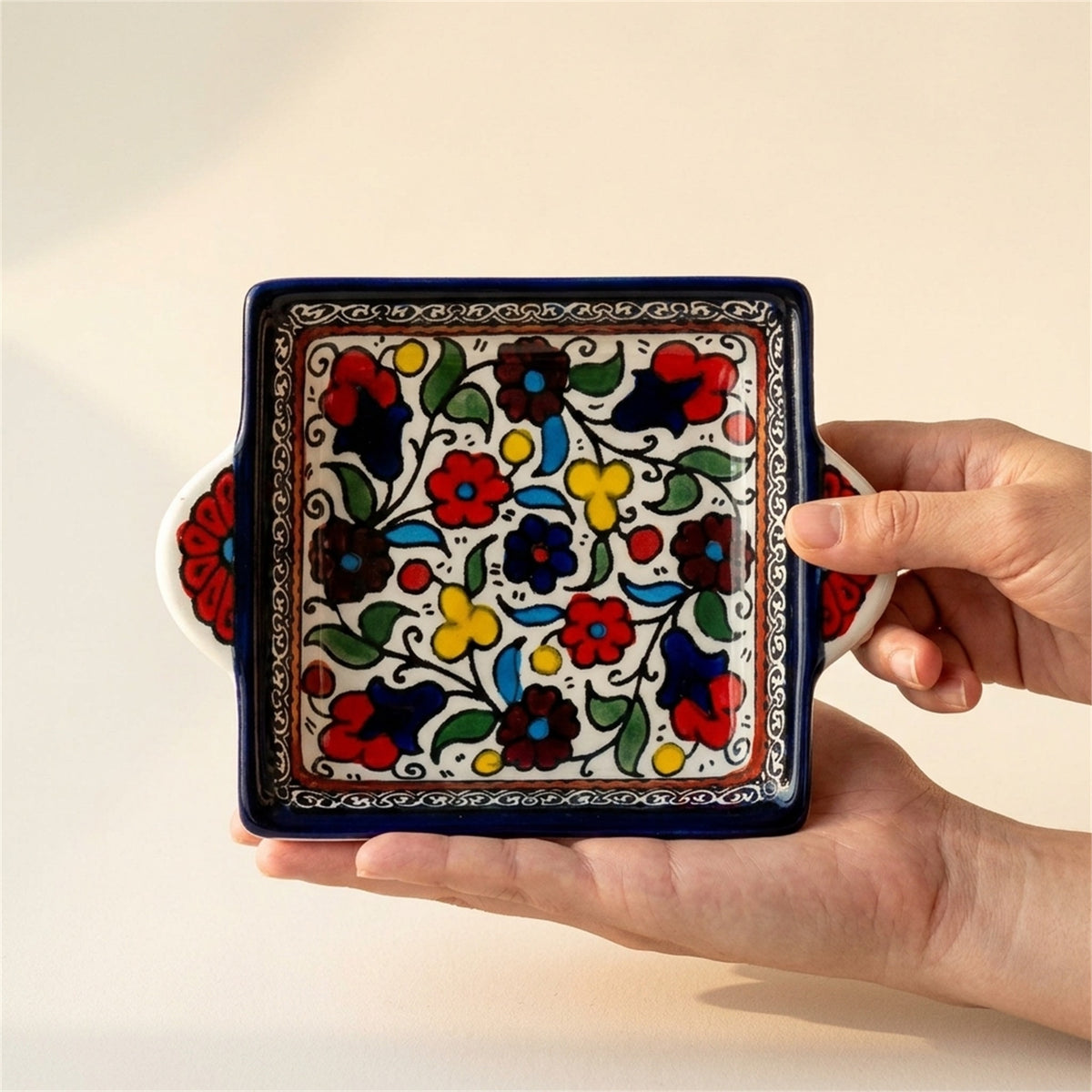 Handled Serving Dish 6.3 Inch in Floral, held in hands to show scale