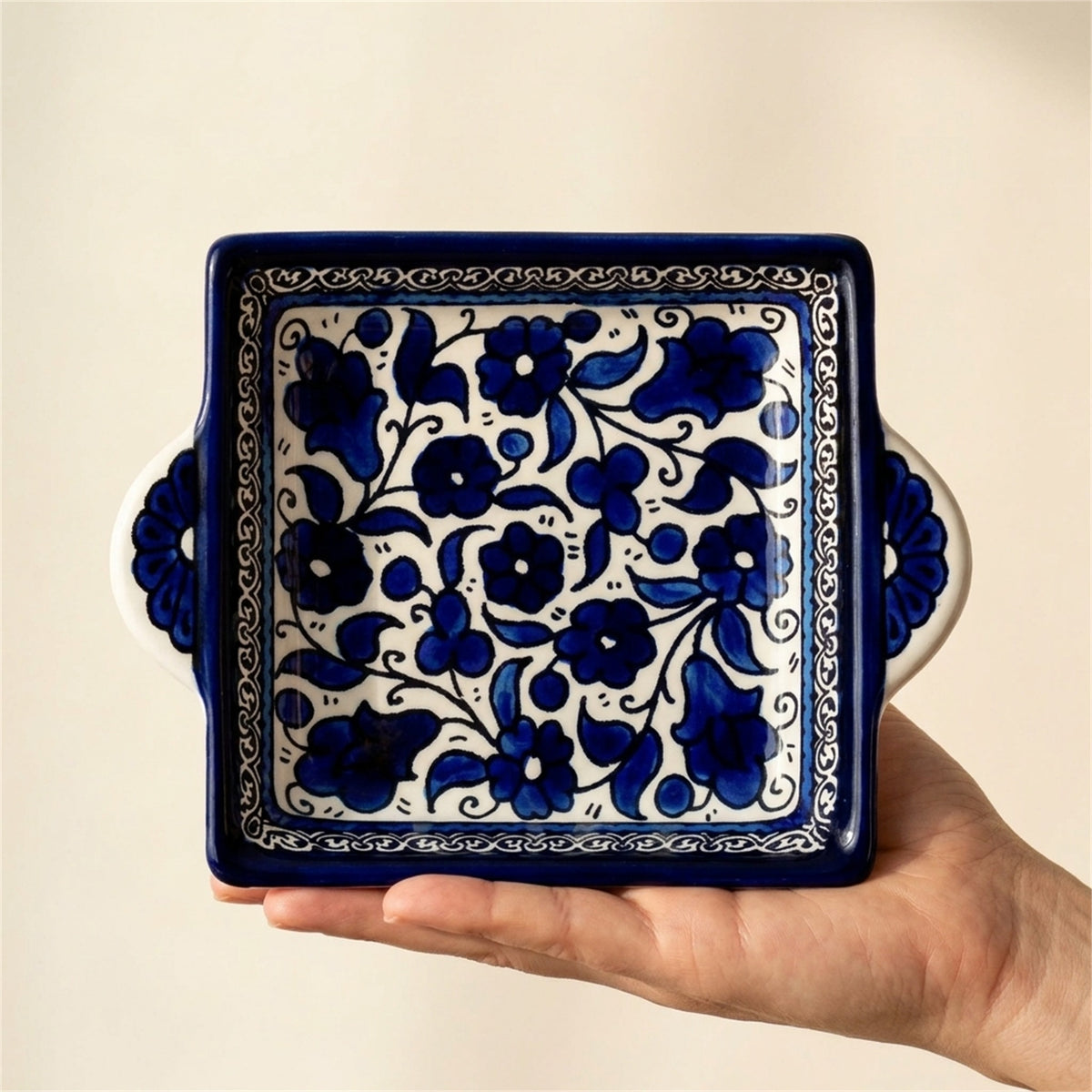 Handled Serving Dish 6.3 Inch in Indigo, held in hands to show scale