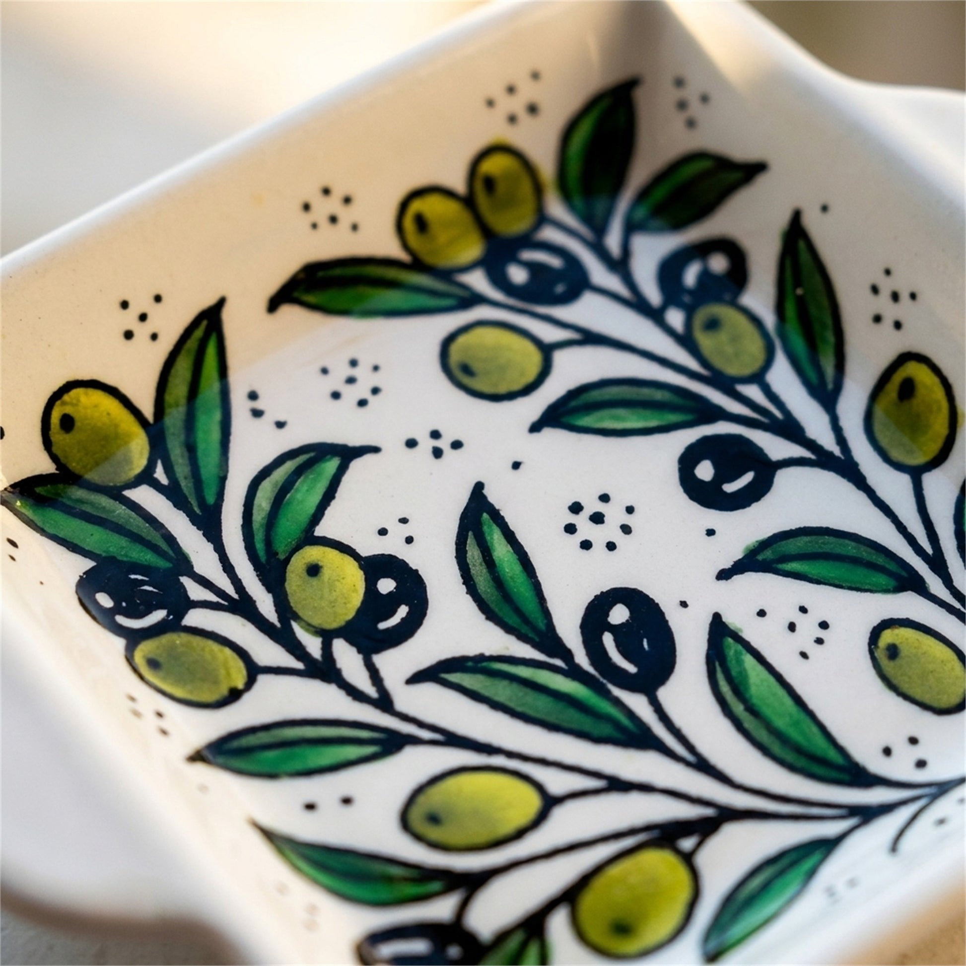 Handled Serving Dish 6.3 Inch in Olive Green, close-up of the hand-painted detail