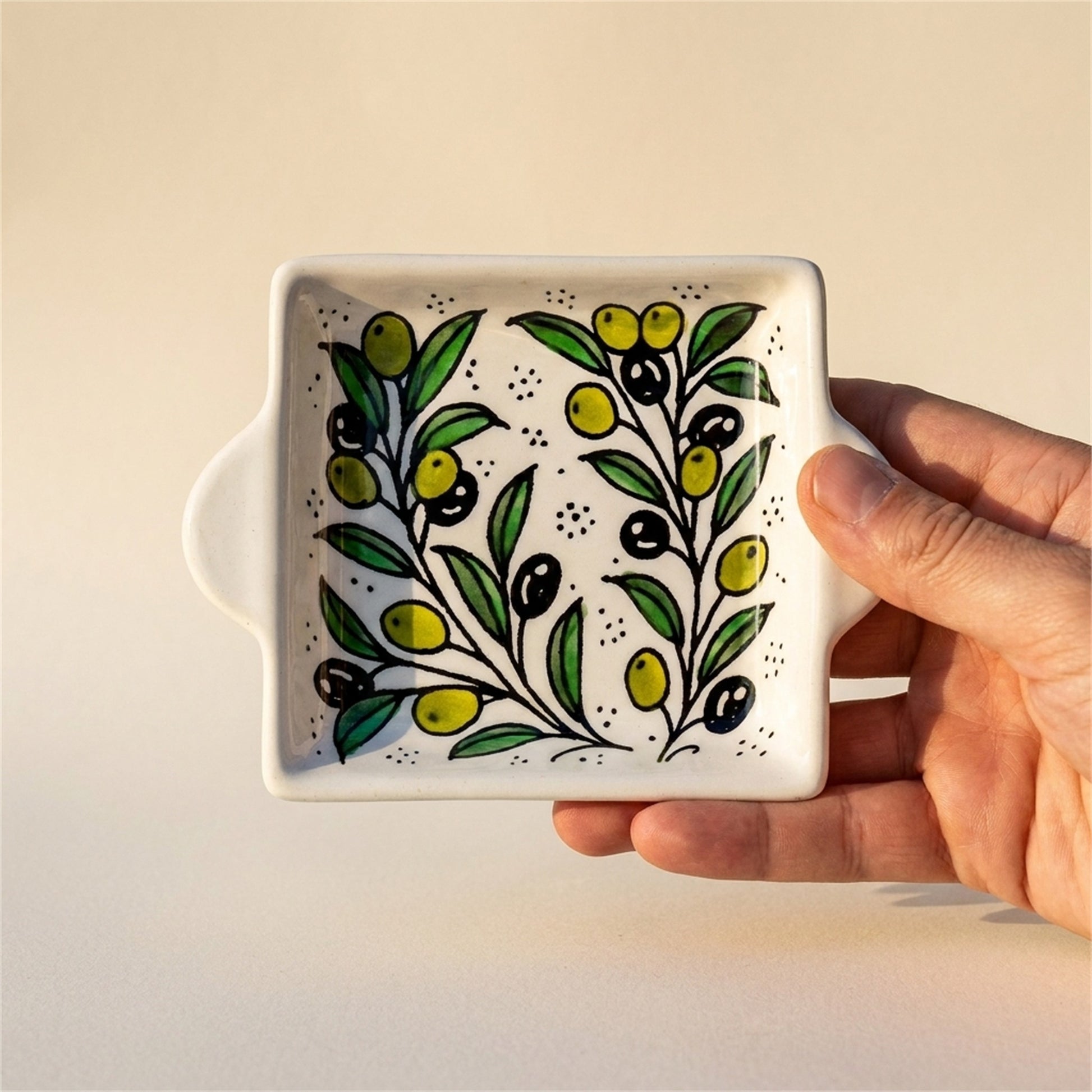 Handled Serving Dish 6.3 Inch in Olive Green, held in hands to show scale