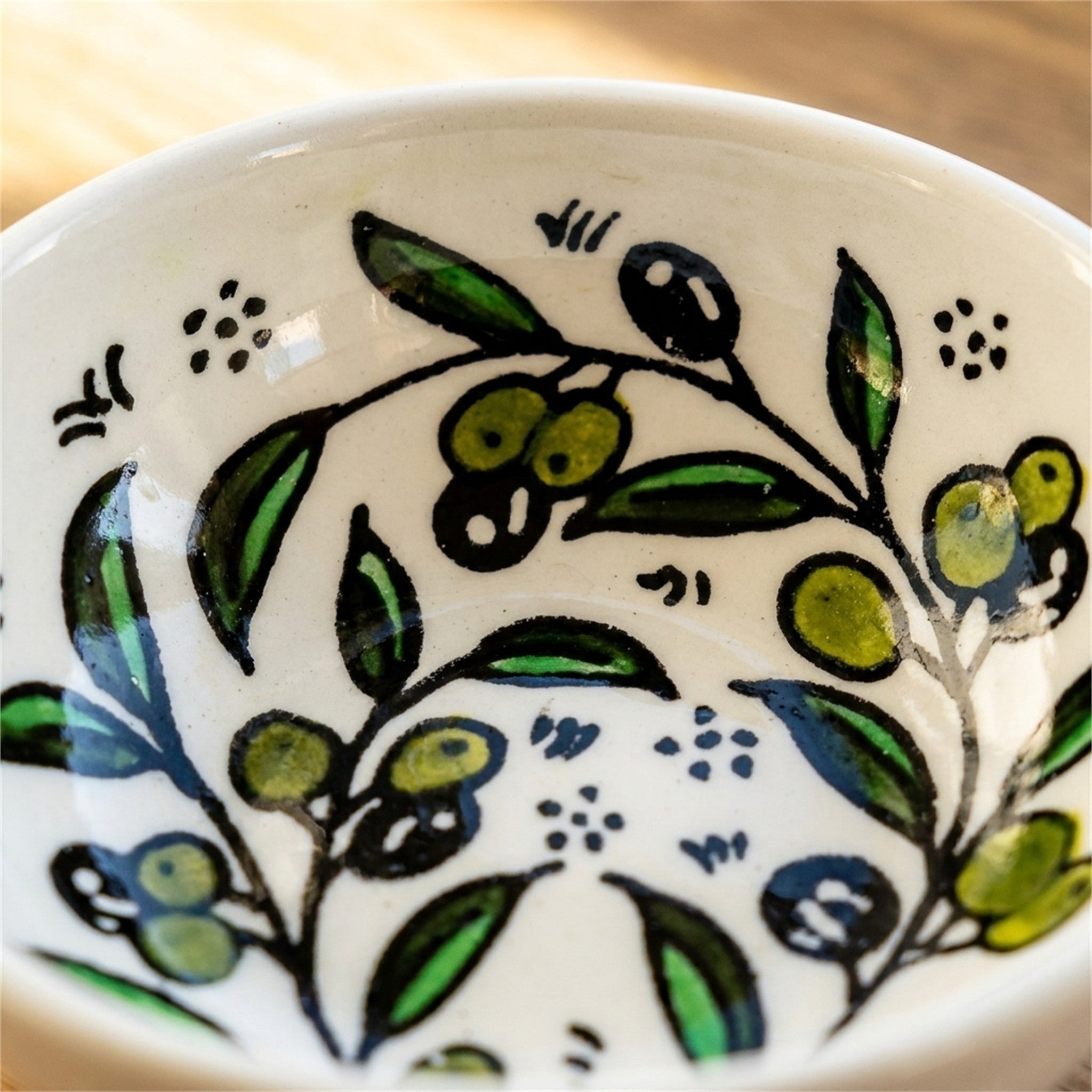 Round Ceramic Serving Bowl 3.54 Inch in Olive Green, close-up of the hand-painted detail