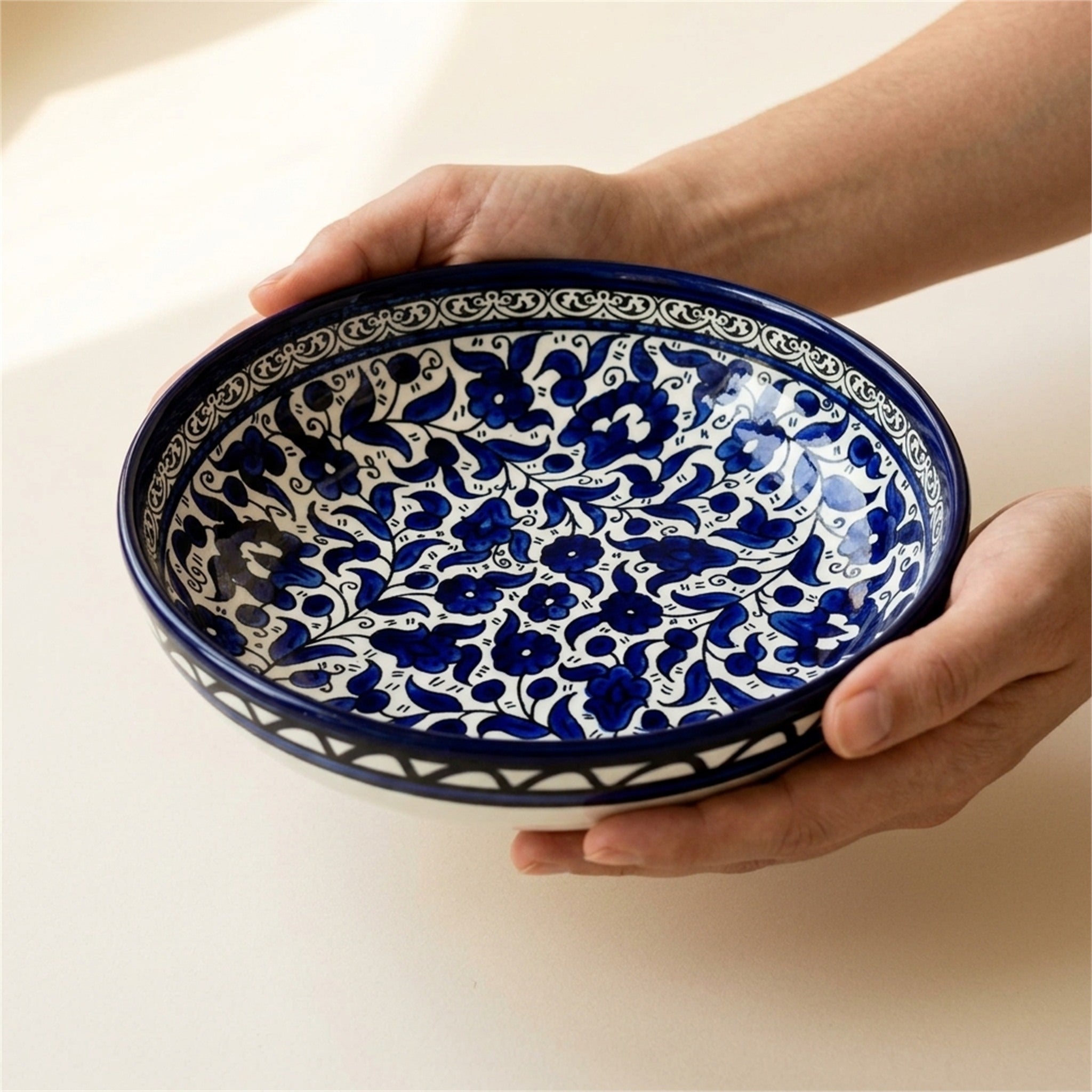 Round Ceramic Serving Bowl 9.45 Inch in Indigo, held in hands to show scale