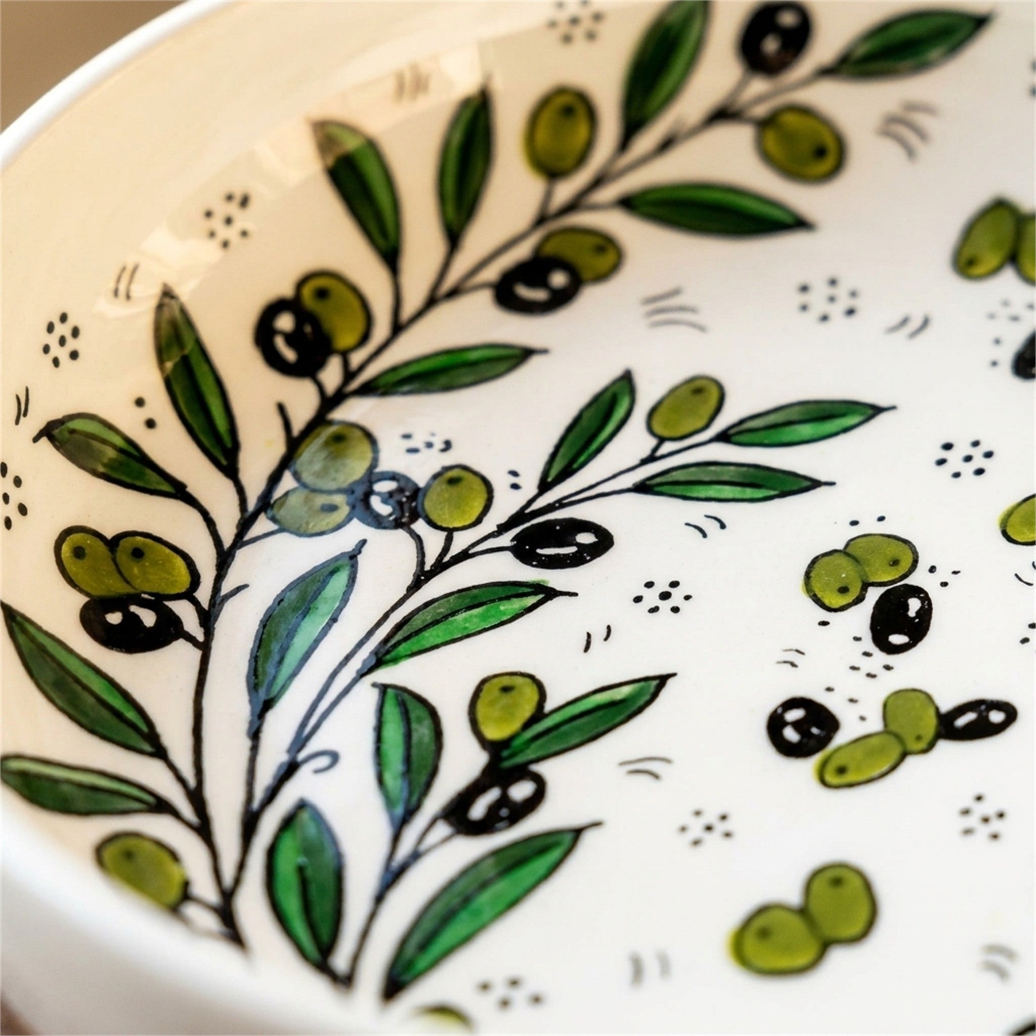 Round Ceramic Serving Bowl 9.45 Inch in Olive Green, close-up of the hand-painted detail