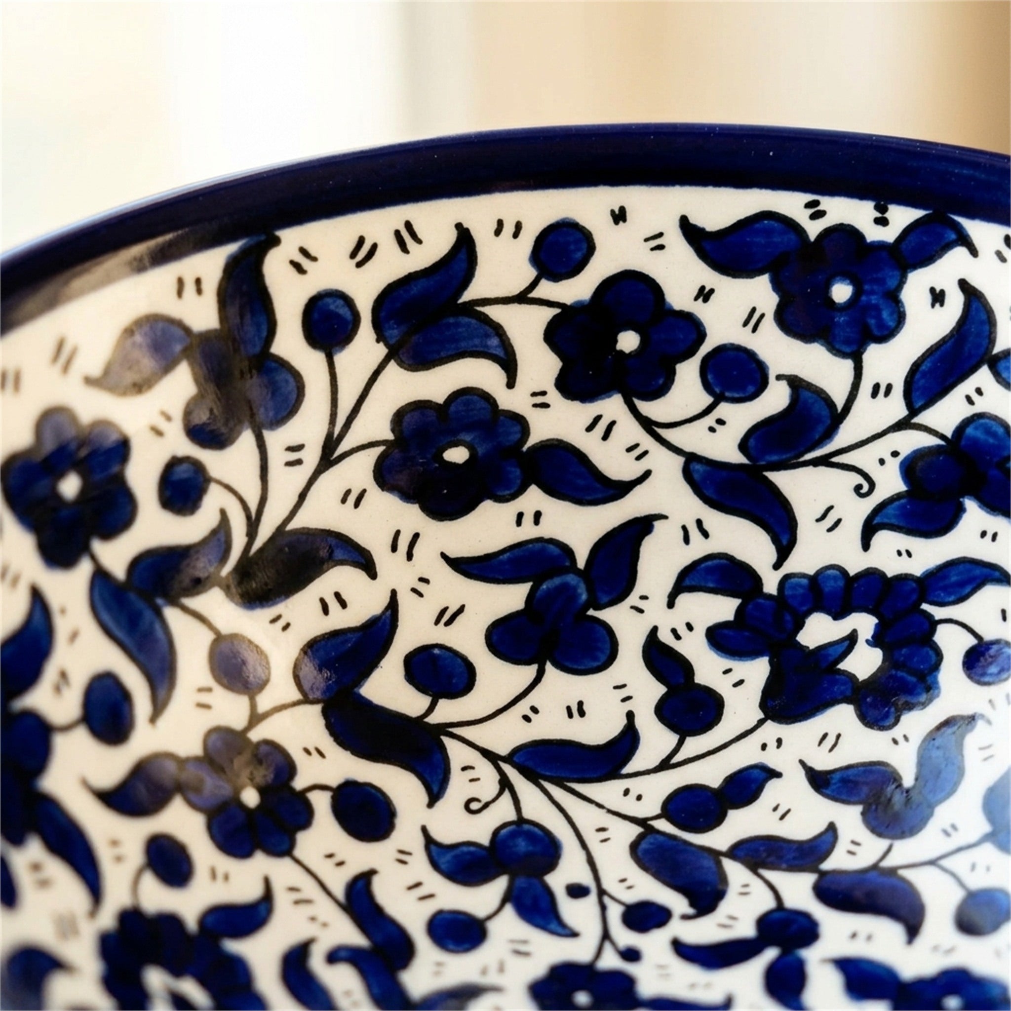 Round Ceramic Serving Bowl 9.84 Inch in Indigo, close-up of the hand-painted detail