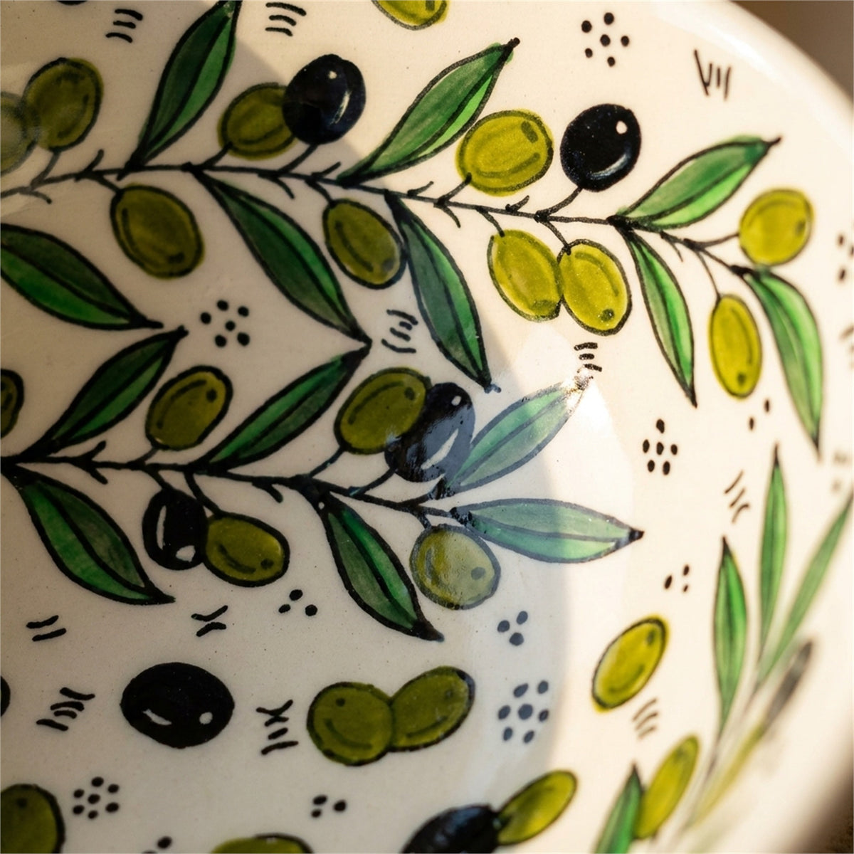 Round Ceramic Serving Bowl 9.84 Inch in Olive Green, close-up of the hand-painted detail