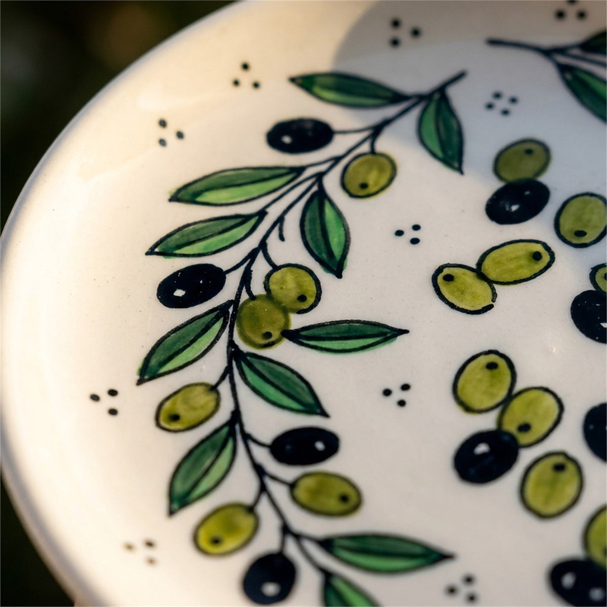 Round Ceramic Serving Dish 7.48 Inch in Olive Green, close-up of the hand-painted detail