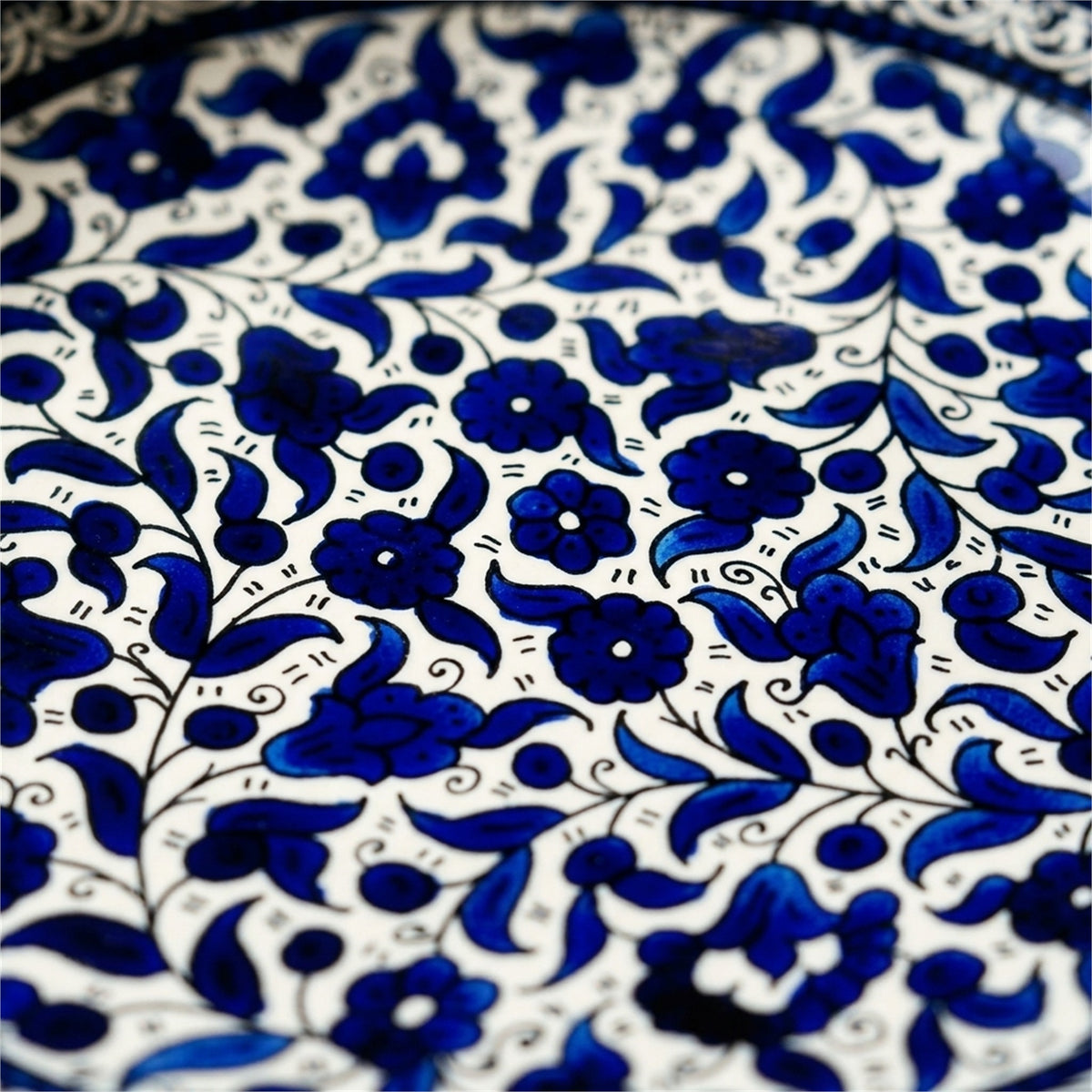 Round Ceramic Serving Dish 9.84 Inch in Indigo, close-up of the hand-painted detail